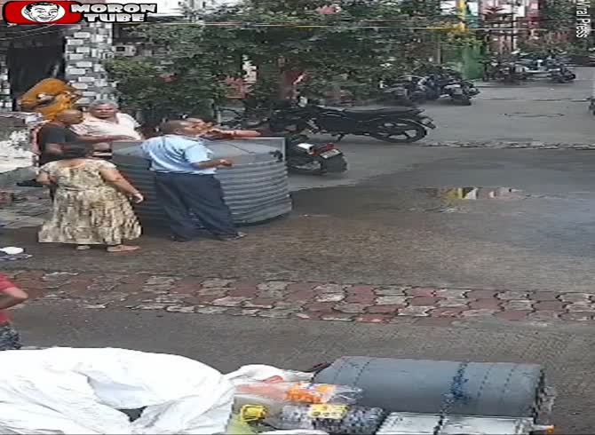 Video :As she donates to a temple, a massive tank of water falls on her